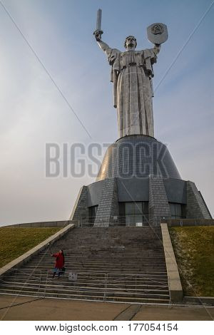 Mother Motherland monument - waman takes selfie in front of statue