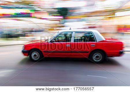 Hongkong Taxi On The Road In Motion Blur