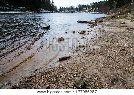 Mountain River In Summer Surrounded By Forest