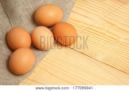 chicken Egg on sackcloth rustic background. top view
