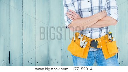 Digital composite of Carpenter against blue wood panel