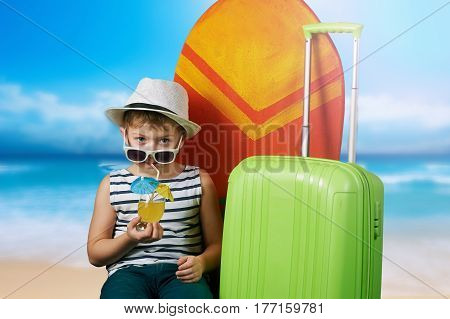 beautiful boy with a surfboard . The dream of tropical countries