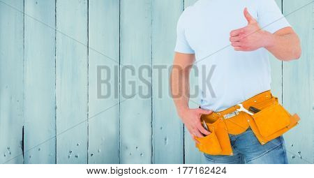 Digital composite of Carpenter against blue wood panel