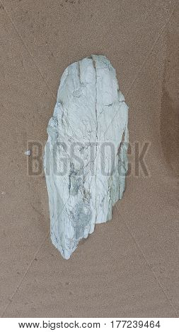 Stone on Sandy beach on the Island of Crete