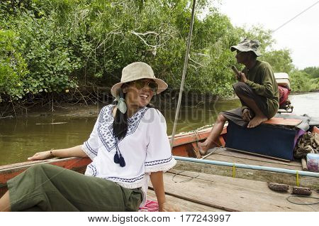 Thai Old Man Riding Long Tail Boat Bring People Travel Visit And Looking Riverbank And Mangroves For