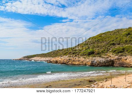 Summer vacation background with turquoise sea water bay and pine trees in Thasos Island, Greece