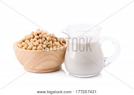 Soy milk in a glass jar and soybeans Isolated on white background.