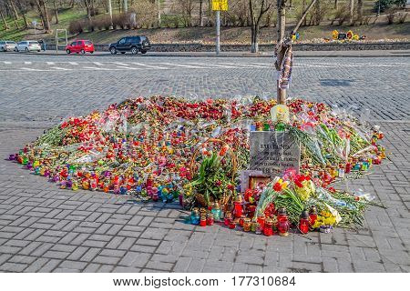 KIEV, UKRAINE - MARCH 22, 2014: Flowers for the dead ahead The International Convention Center.