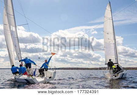 Konakovo , April 19 : Public open. Team athletes participating in the sailing competition - match race , held in Konakovo on river Volga April 19, 2016