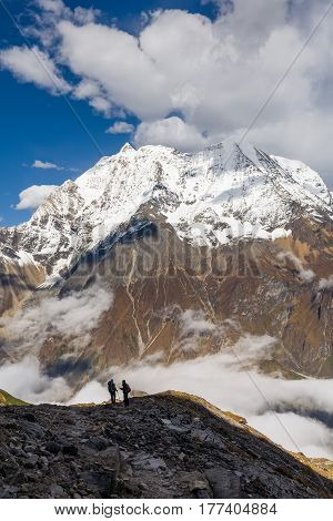 Trekker On The Way To The Valley Covered With Cloud On Manaslu Circuit Trek In Nepal