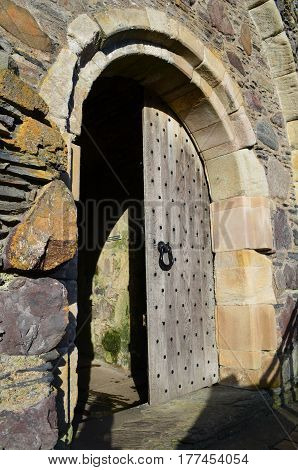 Wooden castle doors at Dunstaffnage Castle in Scotland.