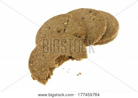 The cookies grains was bitten on white back ground.