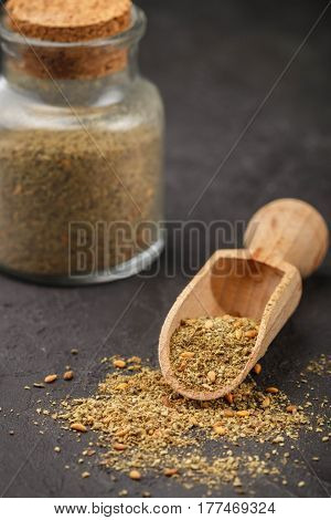 Zaatar - Mix Of Oriental Spices On A Dark Stone Background. Seasoning Made From Dried Herbs, Mixed W