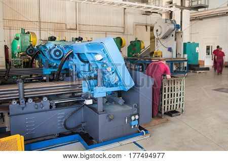 metal laser cutting machine operator working in factory. the modern laser machine at factory on production of metal details. Business concept. work concept at the industrial enterprise