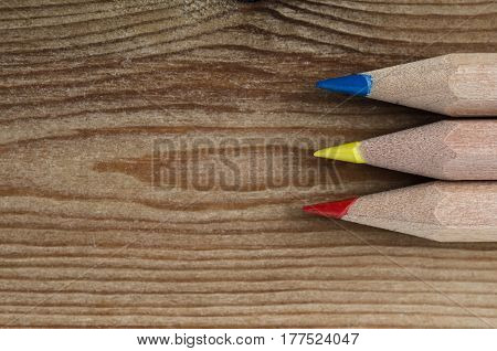 Pencils In Primary Colours On Wood