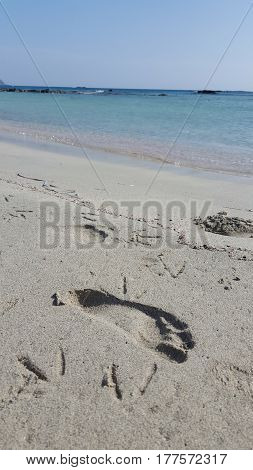 Footprint at a beach with pink sand