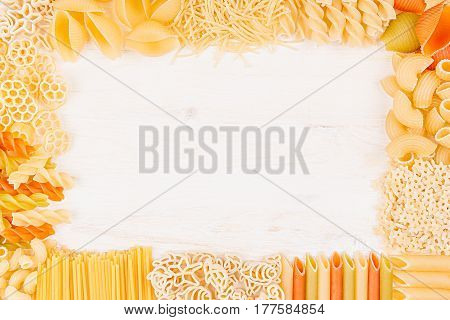 Pasta background decorative frame of assortment different kinds italian macaroni. Mock up restaurant menu.