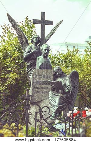 ST.PETERSBURG RUSSIA - AUGUST 04 2013: Tombstone to russian composer P.I. Tchaikovsky at Tikhvin Cemetery in St Petersburg. Necropolis of Alexander Nevsky Lavra.