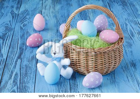Bright Color Easter Eggs With Banny On Blue Table
