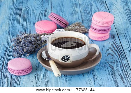 Pink Macaroons And Coffee Cup Near Dried Levender