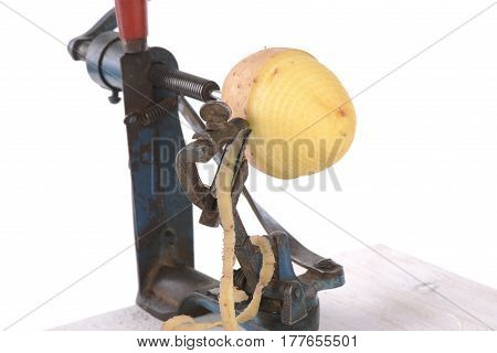original old maschine apple peeler and potato made of metal