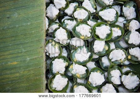 Thai dessert name Kanom Tako- Thai dessert sweet pudding with Coconut Corn Sago Taro wrapped with banana leaves
