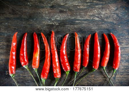 red hot chilli peppers on wooden background
