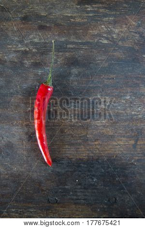 red hot chilli peppers on wooden background