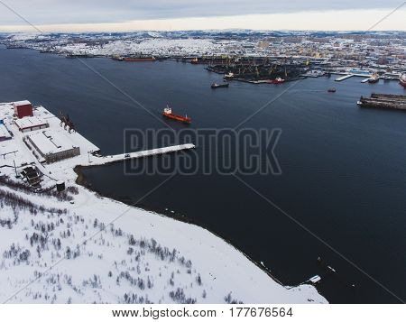Beautiful aerial air winter vibrant view of Murmansk, Russia, a port city and the administrative center of Murmansk Oblast, Kola peninsula, Kola Bay, shot from quadrocopter drone