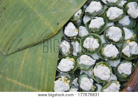 Thai dessert sweet pudding by milk and coconut on banana leaf background