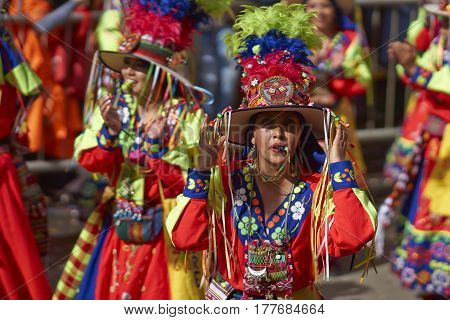ORURO, BOLIVIA - FEBRUARY 25, 2017: Tinkus dancers in colourful costumes performing at the annual Oruro Carnival. The event is designated by UNESCO as being Intangible Cultural Heritage of Humanity.
