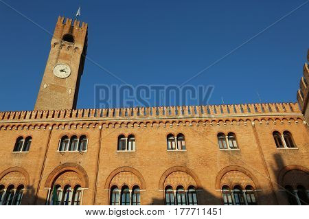 old building with red brick facade and tower called the Palace of the Three Hundred in Piazza dei Signori Treviso Italy