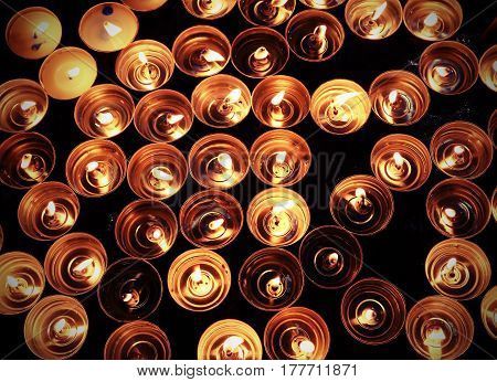 Candles Lit With The Warm Flame During The Religious Ceremony