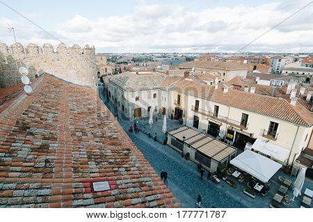 Avila Spain - November 11 2014: Cityscape of Avila from Medieval Walls a cloudy day. The old city and its extramural churches were declared a World Heritage site by UNESCO