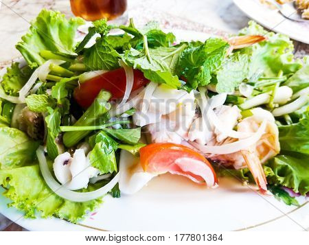 Thai Spicy Seafooe Salad in white plate