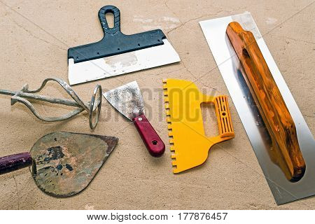 Tool for working plaster on the floor