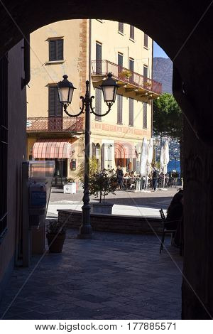 Menaggio Italy - 10 March 2017: people eating and drinking on a restaurant of Menaggio Italy