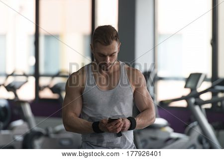 Healthy Man Using Smartphone While Resting