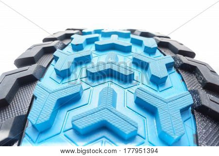 Bottom view of fromt part of colorful running shoe sole isolated on white