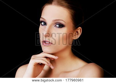 Attractive blonde topless woman with dark make up