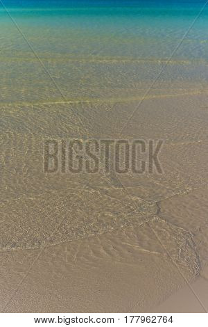 White Sandy Beach With Calm Crystal Clear Sea.