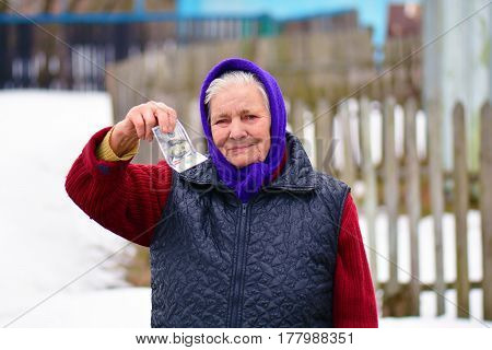 Senior Woman Is Holding Money In Her Hand. Money In Old Womans Hand