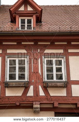 Old Historical Building And Half-timber House With Red Wood