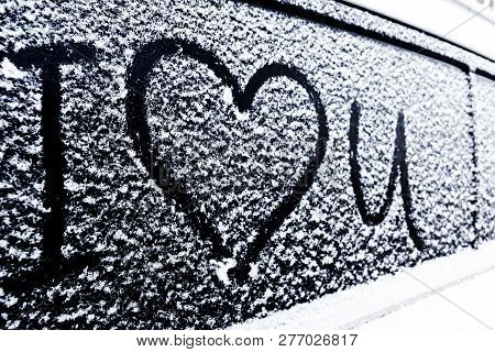 I Love You Heart Symbol On Frozen Window Of The Car. Shape Of Heart Drawn On Snow On Front Window Of