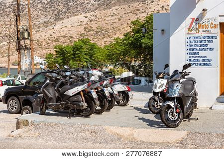 Sifnos, Greece - September 10, 2018: The Scooters For Rent Are Waiting For Clients On Street In Kama