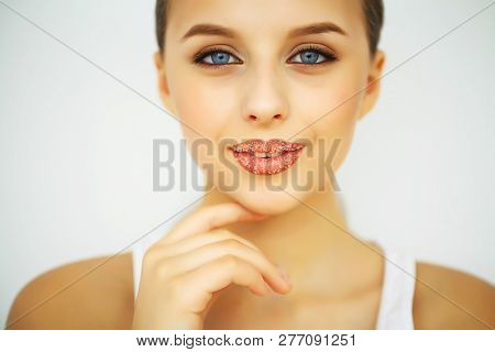 Beauty And Care. Portrait Of A Young Woman With A Beautiful Skin. Beautiful Lips. Girl Takes Care Of