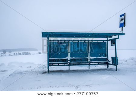 Bus station in the winter field