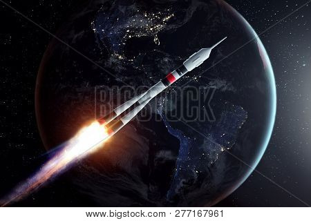 The Rocket Flies In Space Against The Backdrop Of The Earth. The Concept Of Space Exploration, Satel
