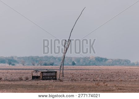 Typical Well Of Pastor Or Shepherd In Hortobágy National Park, Hungary, Puszta Is Famous Ecosystems 