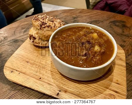 Tasty Hungarian Hot Goulash Soup Bograch Or Gulas Stew With Whole Grain Bread On Wooden Surface At R